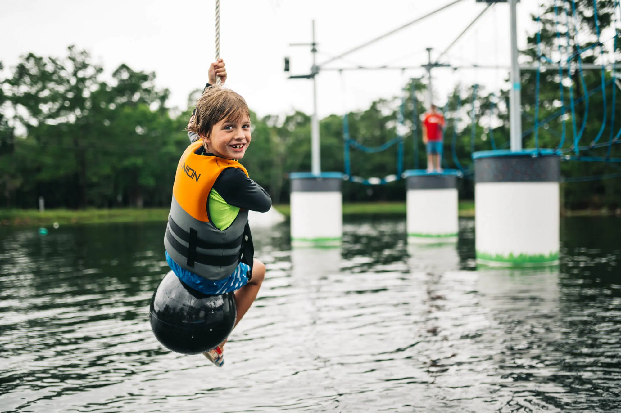Summer camp kids enjoying water activities at Trophy Lakes Charleston